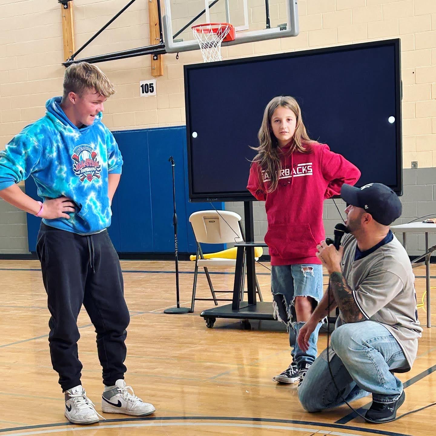 Motivational Youth Speaker Eddie Cortes with students at Sterling Junior High school assembly programA